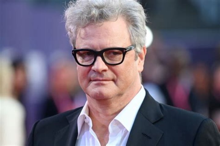Colin Firth curls up with his girlfriend Maggie Cohn as they make their