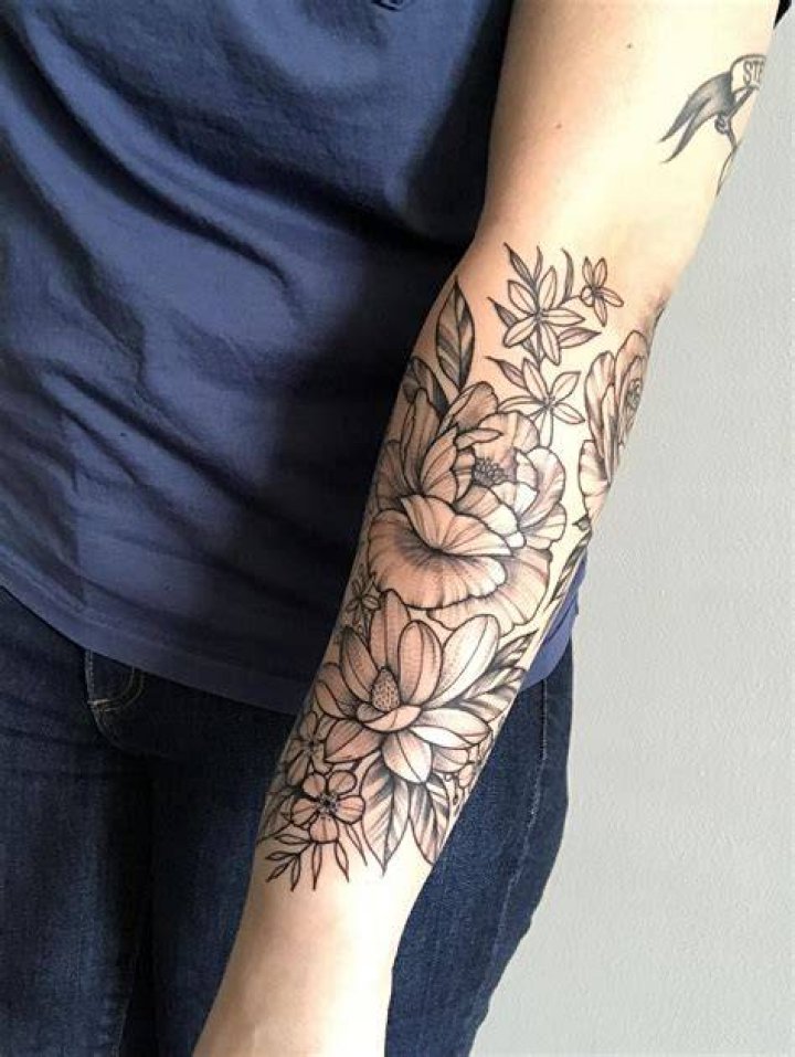 Floral half sleeve completion by Leah B at Waukesha Tattoo co in
